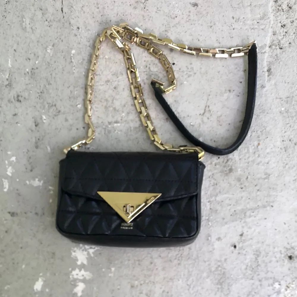 SchutzβMiniβ
Crossbody